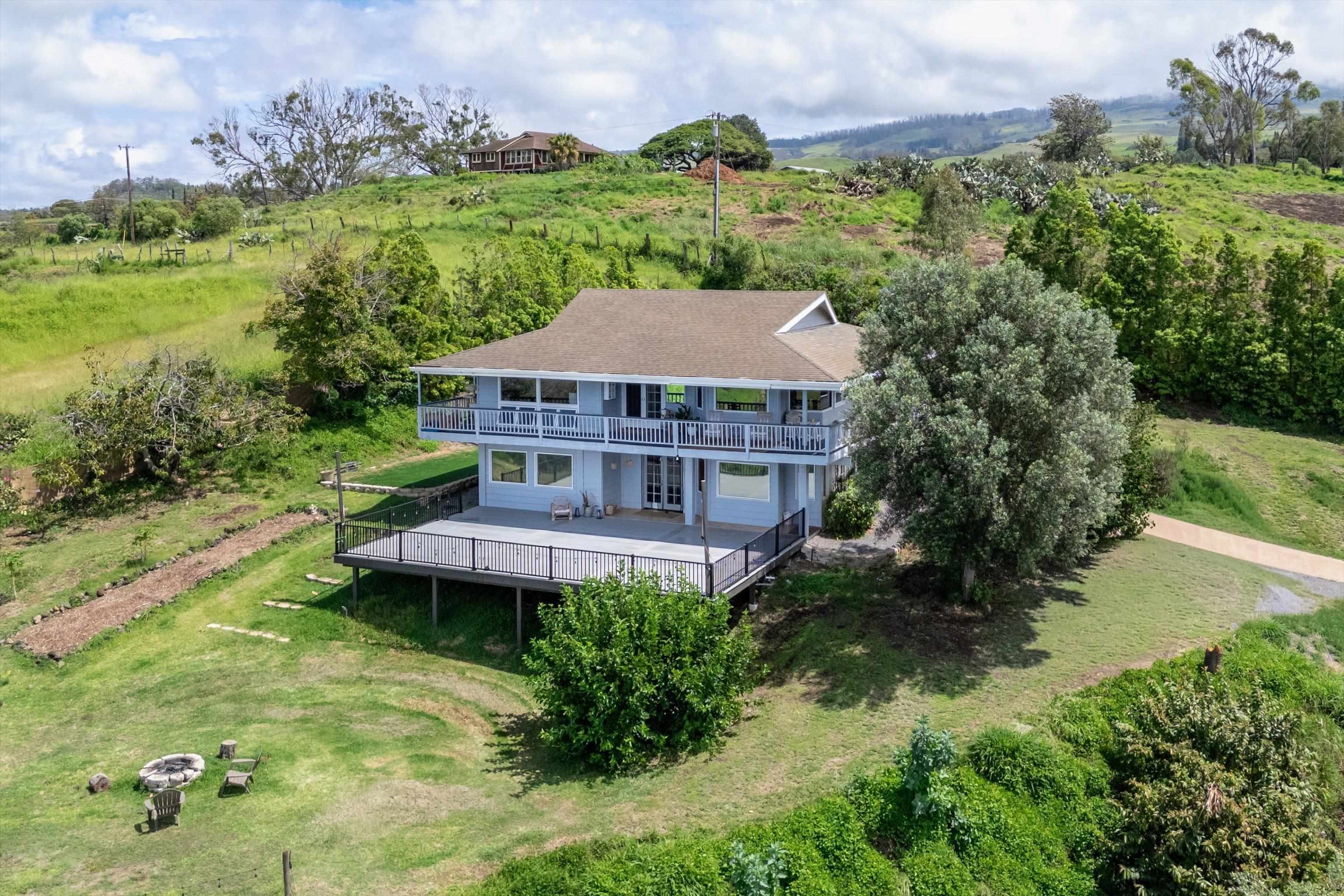 216 Keoni Place Kula, HI 96790 - Photo 3 of 29 an aerial view of a house with pool garden and lake view