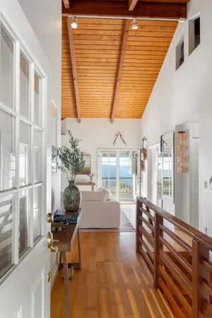 a dining room with furniture and a window