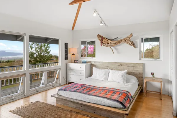 a bedroom with furniture and a window