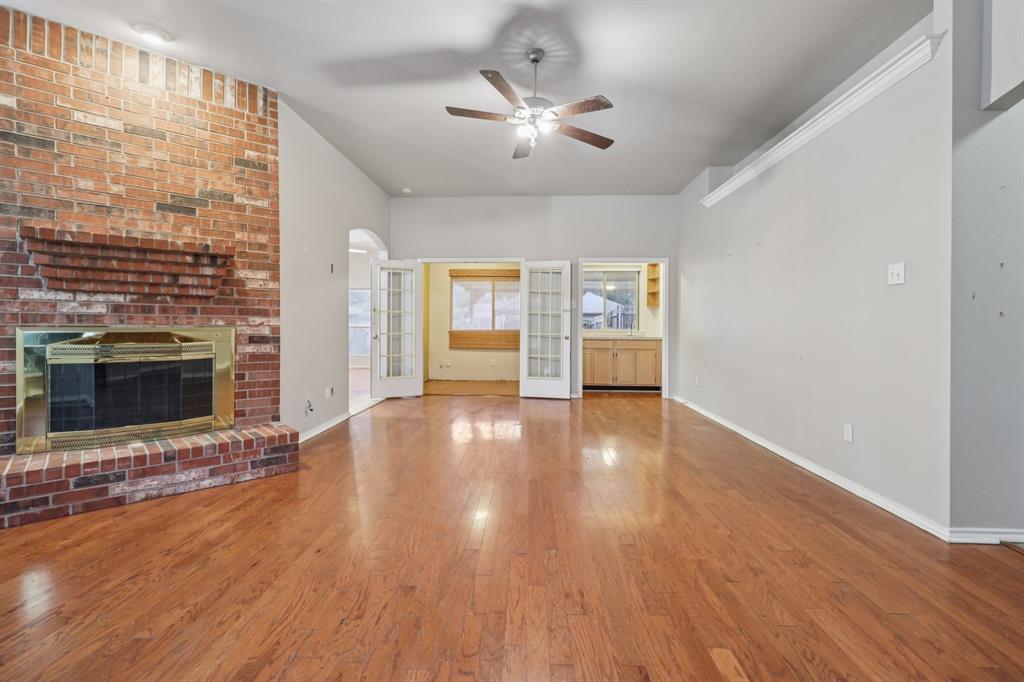 600 North Chattey Road DeSoto, TX 75115 - Photo 11 of 40 a view of an empty room with a fireplace and a window