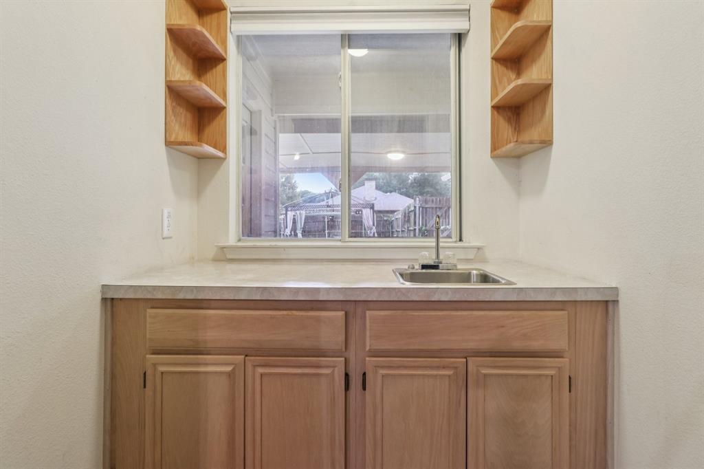 600 North Chattey Road DeSoto, TX 75115 - Photo 12 of 40 a sink with a mirror