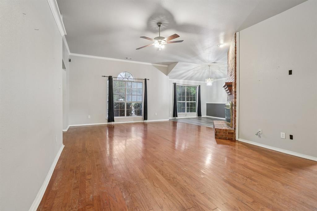 600 North Chattey Road DeSoto, TX 75115 - Photo 14 of 40 wooden floor in an empty room with a window