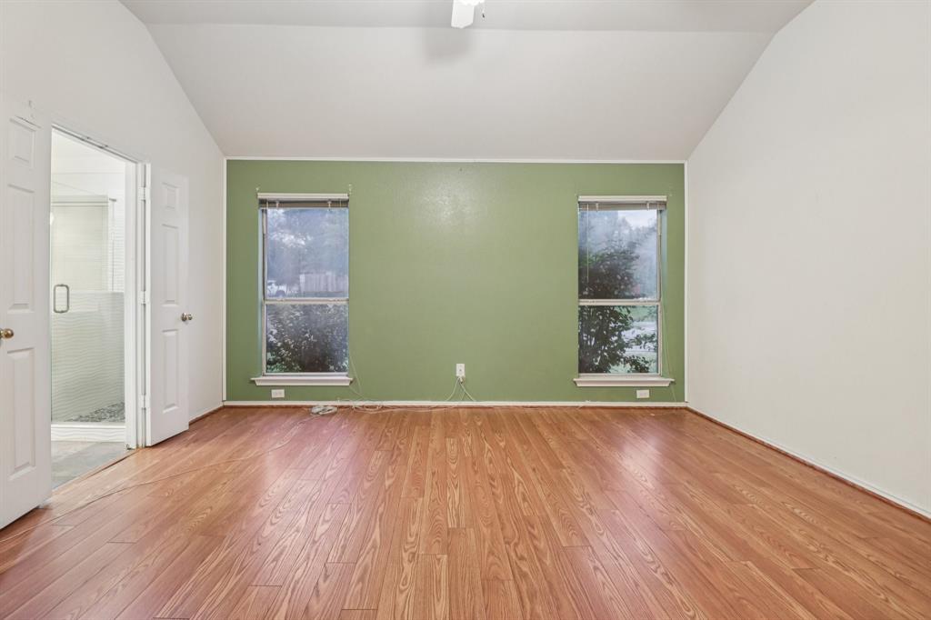 600 North Chattey Road DeSoto, TX 75115 - Photo 25 of 40 an empty room with wooden floor and windows