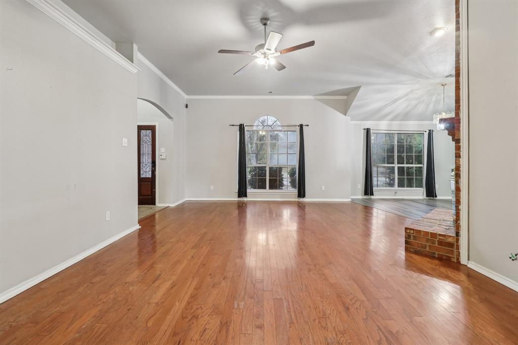 600 North Chattey Road DeSoto, TX 75115 - Photo 3 of 40 wooden floor in an empty room with a window