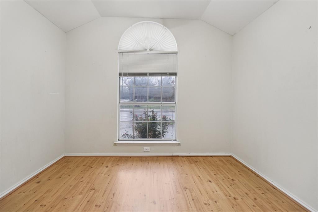 600 North Chattey Road DeSoto, TX 75115 - Photo 29 of 40 an empty room with wooden floor and windows