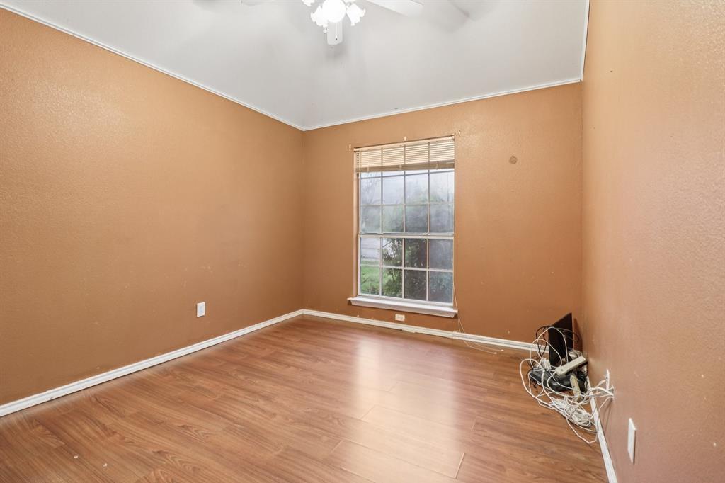 600 North Chattey Road DeSoto, TX 75115 - Photo 32 of 40 wooden floor in an empty room with a window