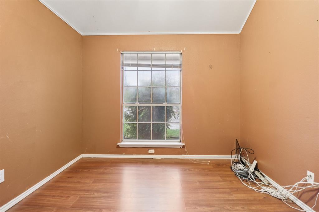 600 North Chattey Road DeSoto, TX 75115 - Photo 33 of 40 a view of empty room with wooden floor and fan