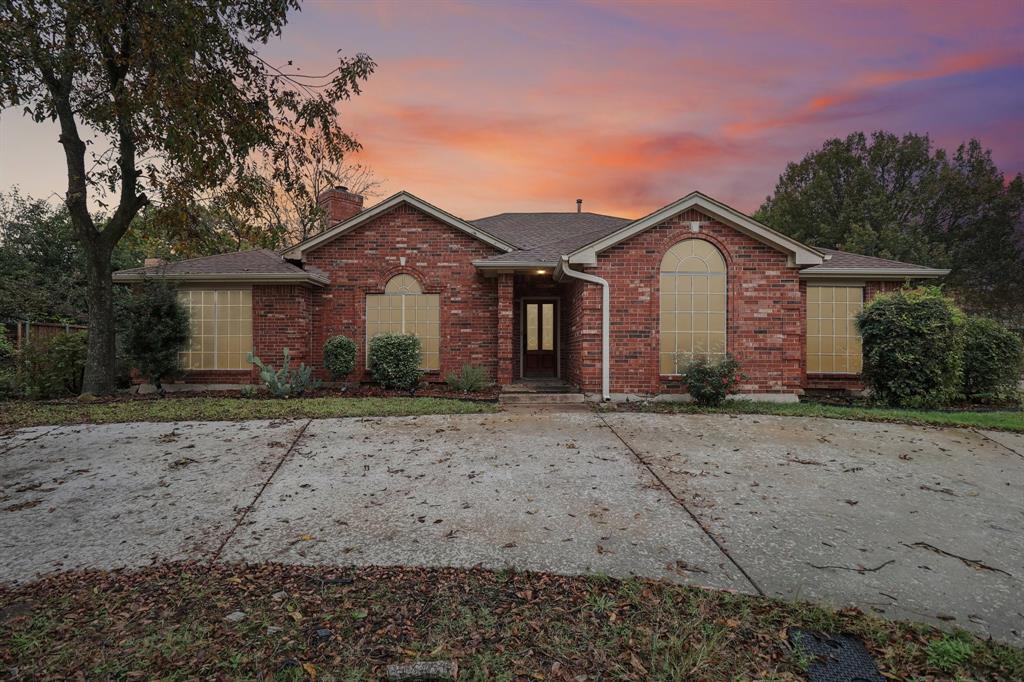 600 North Chattey Road DeSoto, TX 75115 - Photo 36 of 40 a front view of a house with a yard