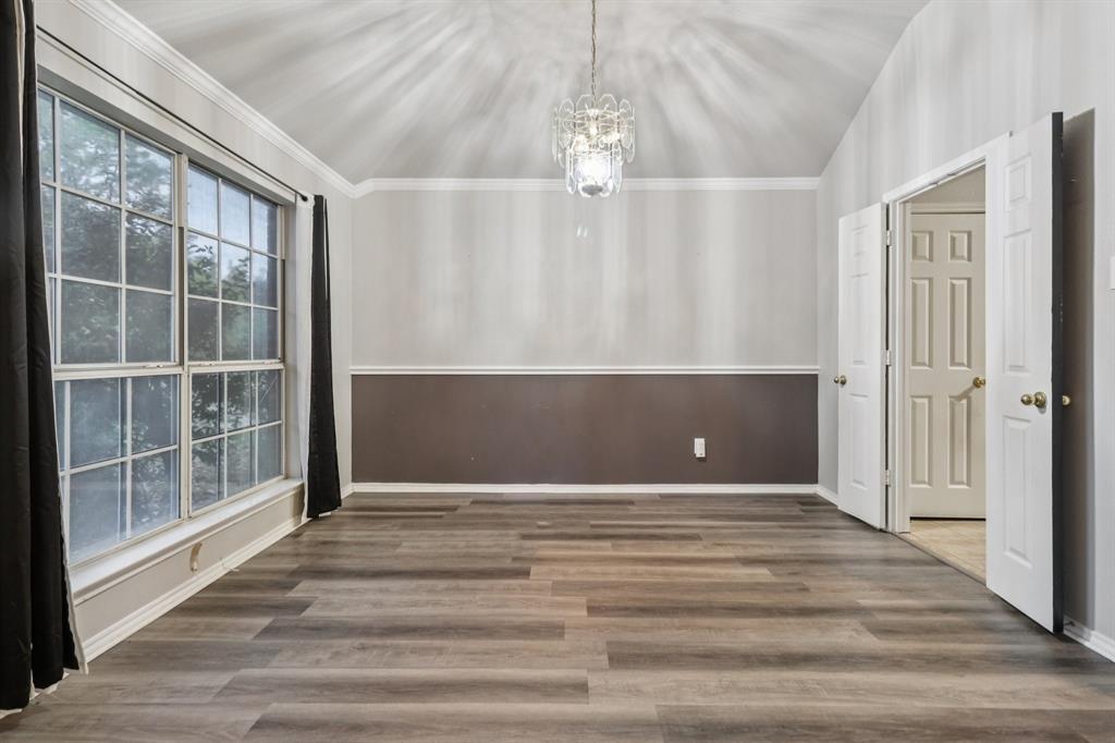 600 North Chattey Road DeSoto, TX 75115 - Photo 4 of 40 a view of a big room with wooden floor and windows