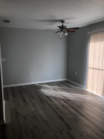 wooden floor and window in an empty room