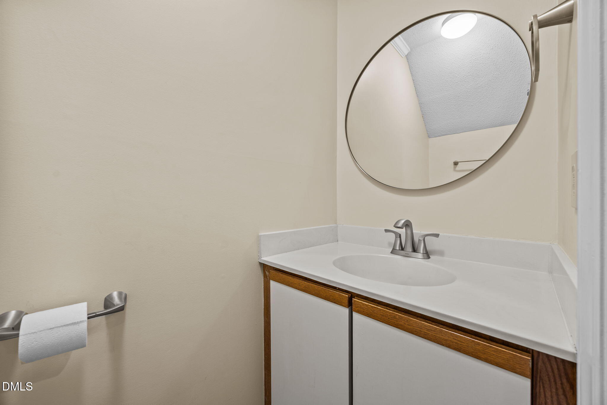 3112 Coachman's Way Durham, NC 27705 - Photo 14 of 32 a bathroom with a sink and a mirror