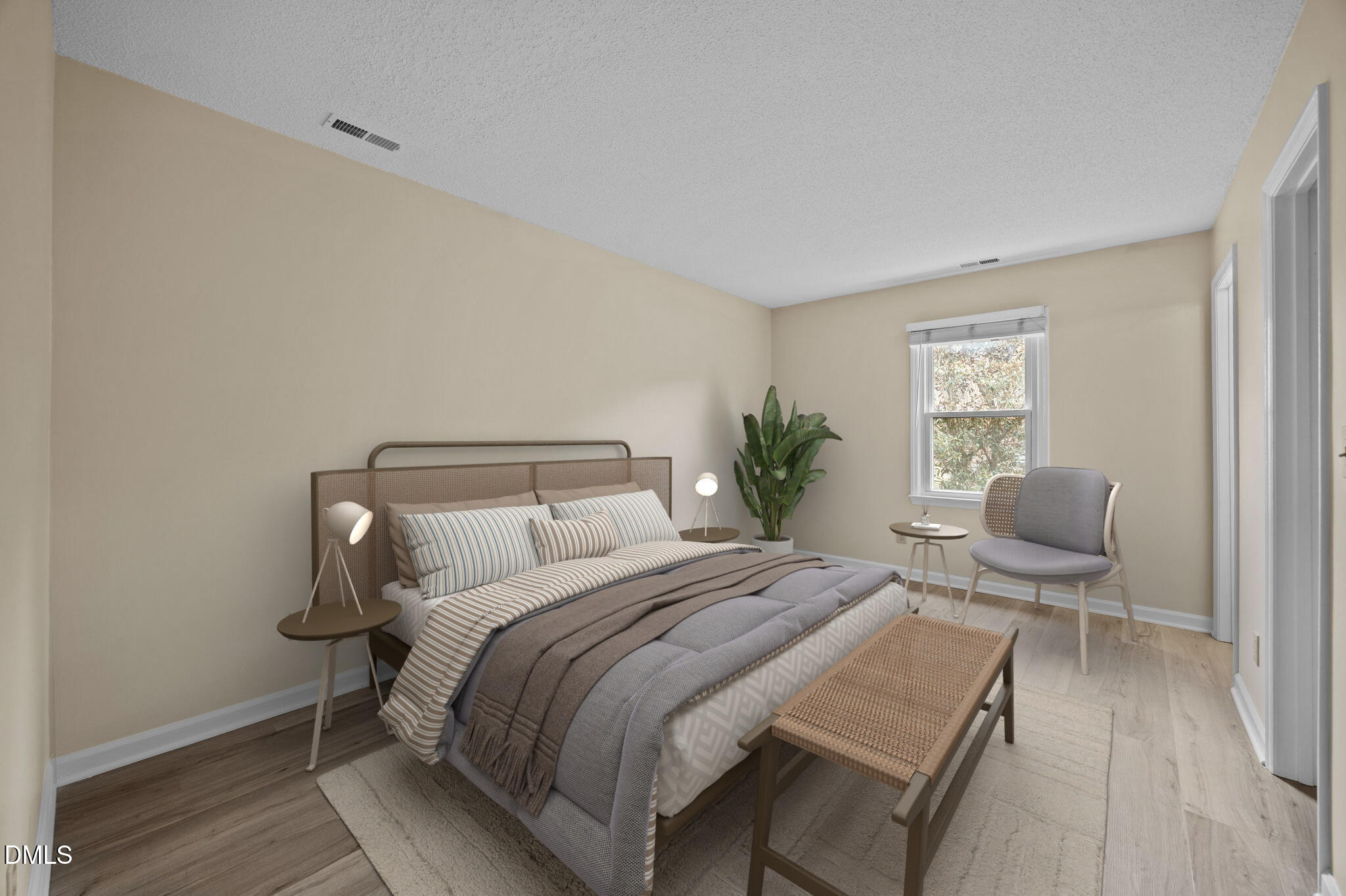 3112 Coachman's Way Durham, NC 27705 - Photo 15 of 32 a bedroom with a bed and chair