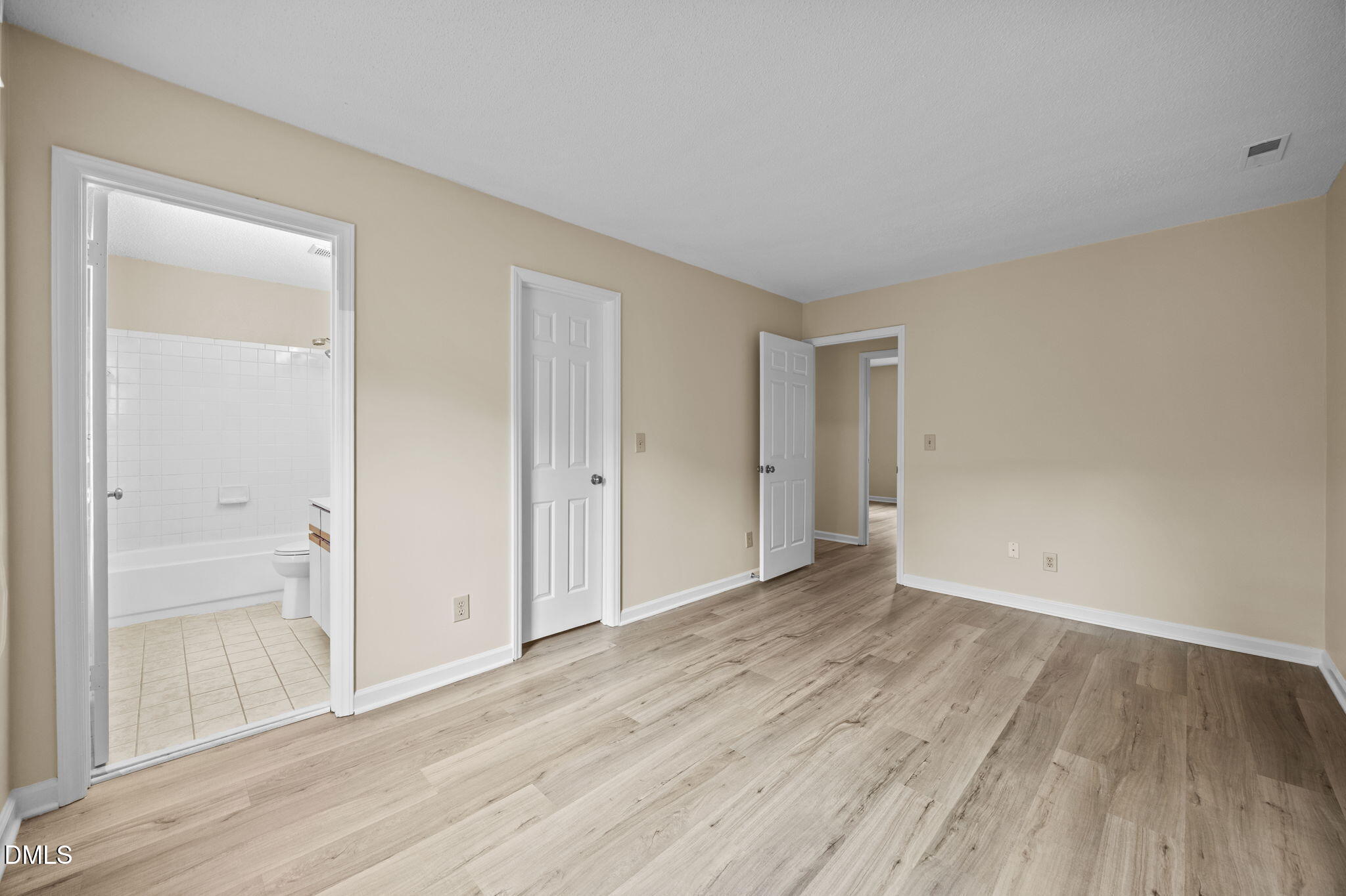 3112 Coachman's Way Durham, NC 27705 - Photo 18 of 32 a view of an empty room with wooden floor and a window