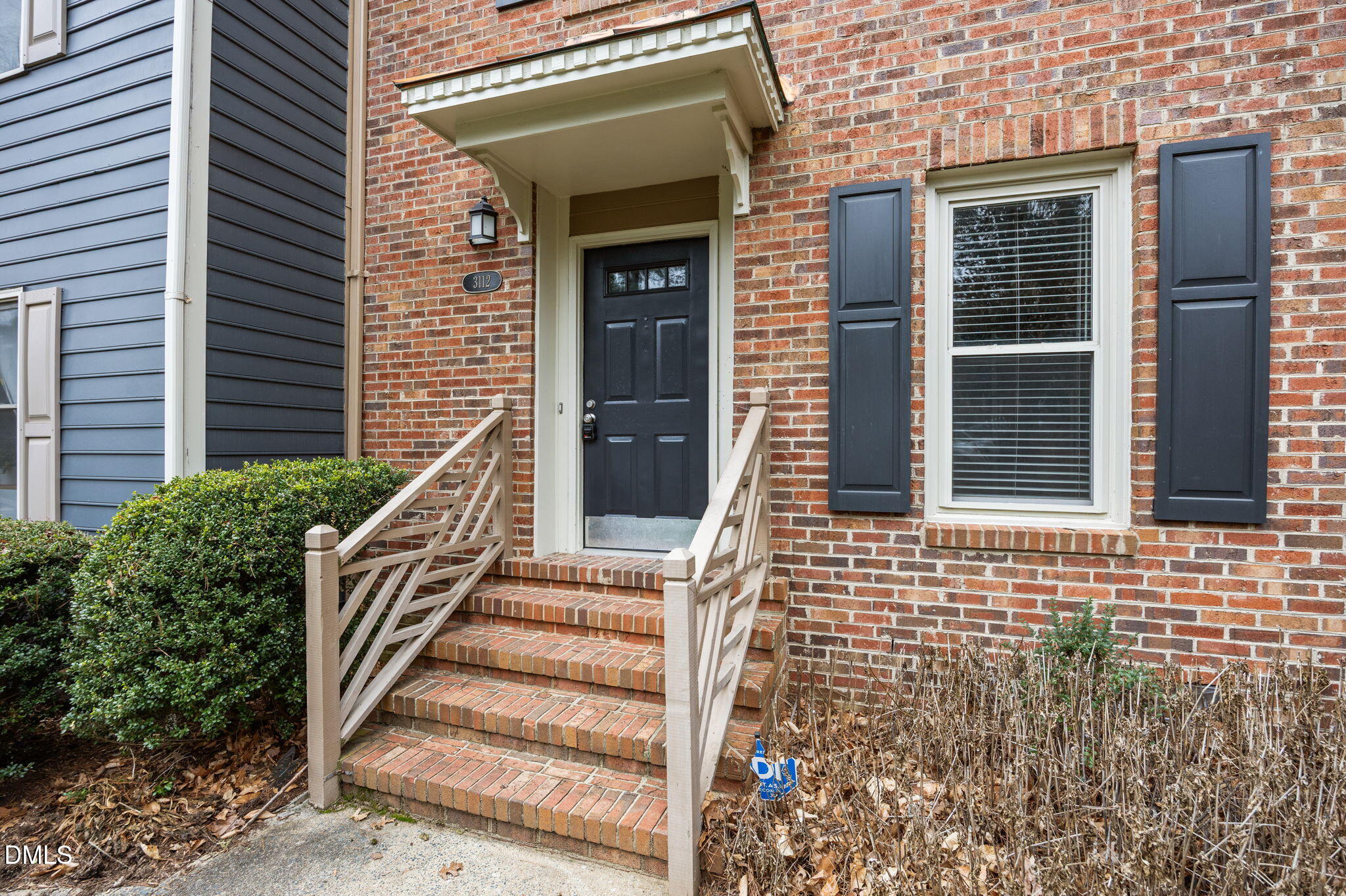3112 Coachman's Way Durham, NC 27705 - Photo 26 of 32 a view of a brick house with stairs and wooden floor