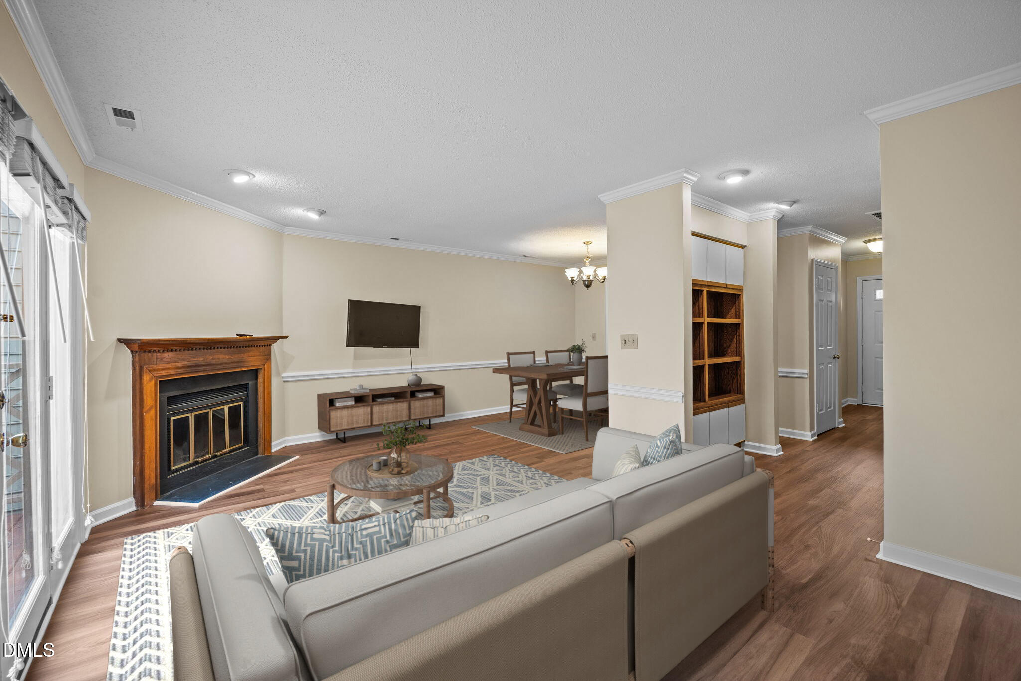 3112 Coachman's Way Durham, NC 27705 - Photo 4 of 32 a living room with furniture a flat screen tv and a fireplace