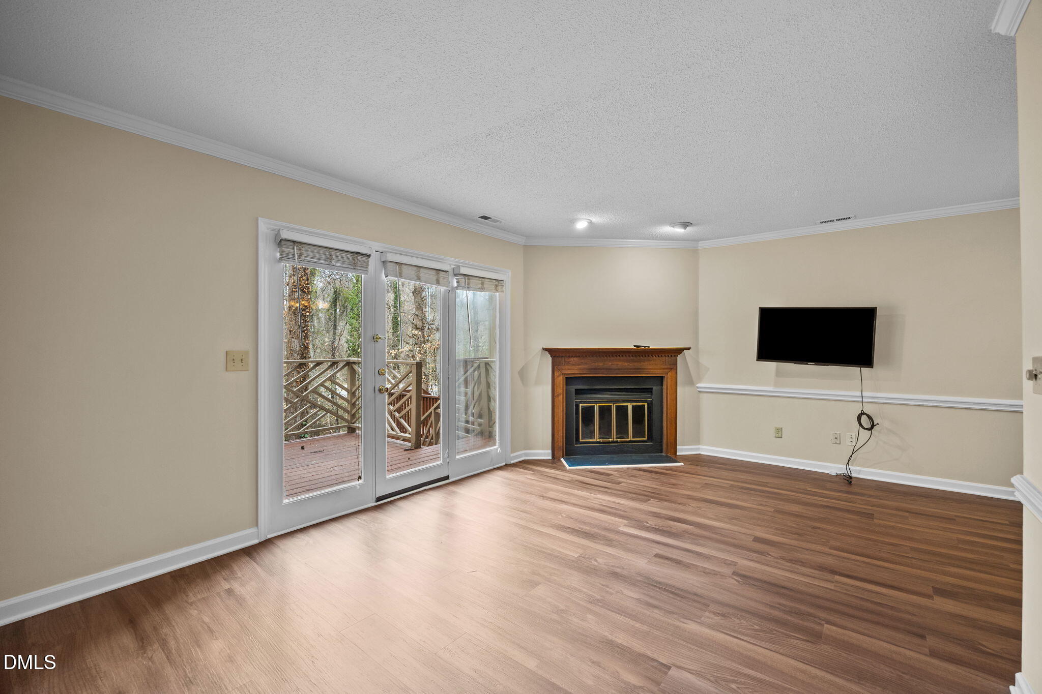 3112 Coachman's Way Durham, NC 27705 - Photo 5 of 32 a view of a livingroom with wooden floor and a fireplace