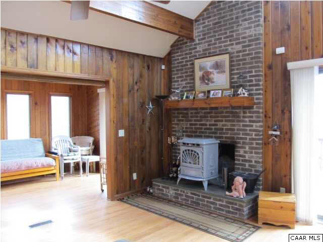 15 Oak Grove Road Palmyra, VA 22963 - Photo 11 of 25 a living room with furniture and a fireplace
