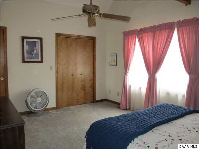 15 Oak Grove Road Palmyra, VA 22963 - Photo 21 of 25 a bedroom with a bed and a window