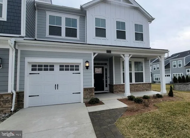 a view of a white house with large windows
