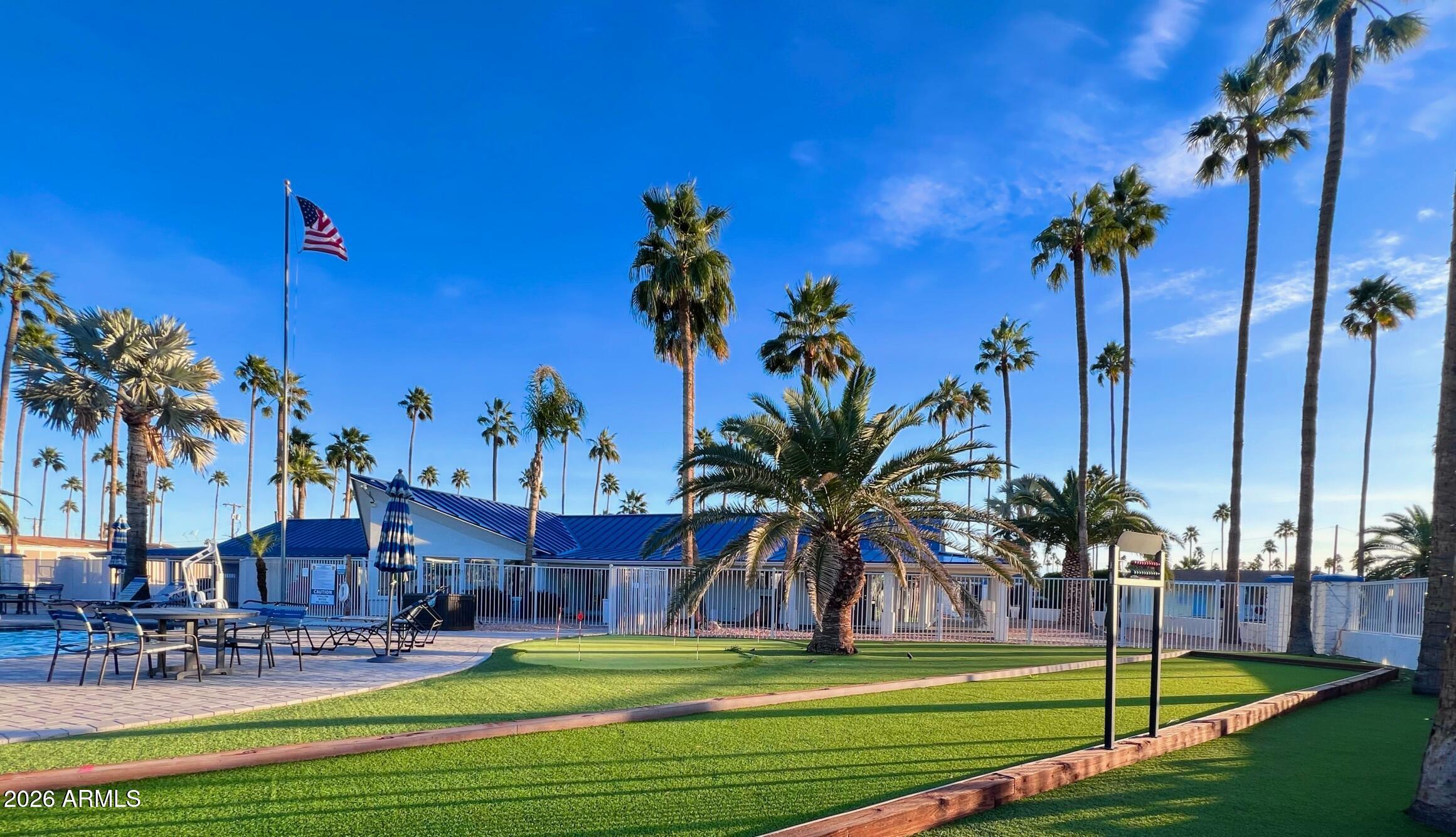 a view of a swimming pool with a table and chairs