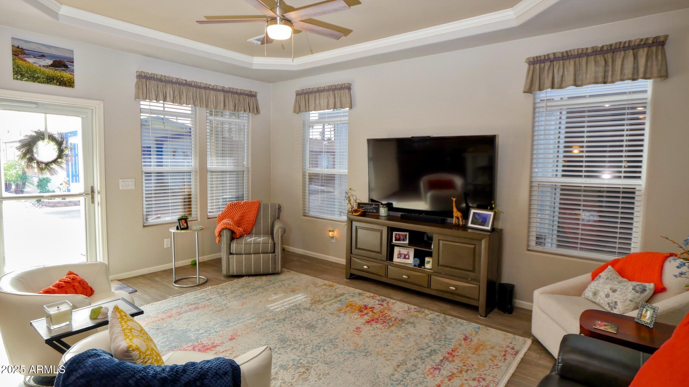 2929 East Main Street, Unit 116 Mesa, AZ 85213 - Photo 11 of 39 a living room with furniture and a flat screen tv