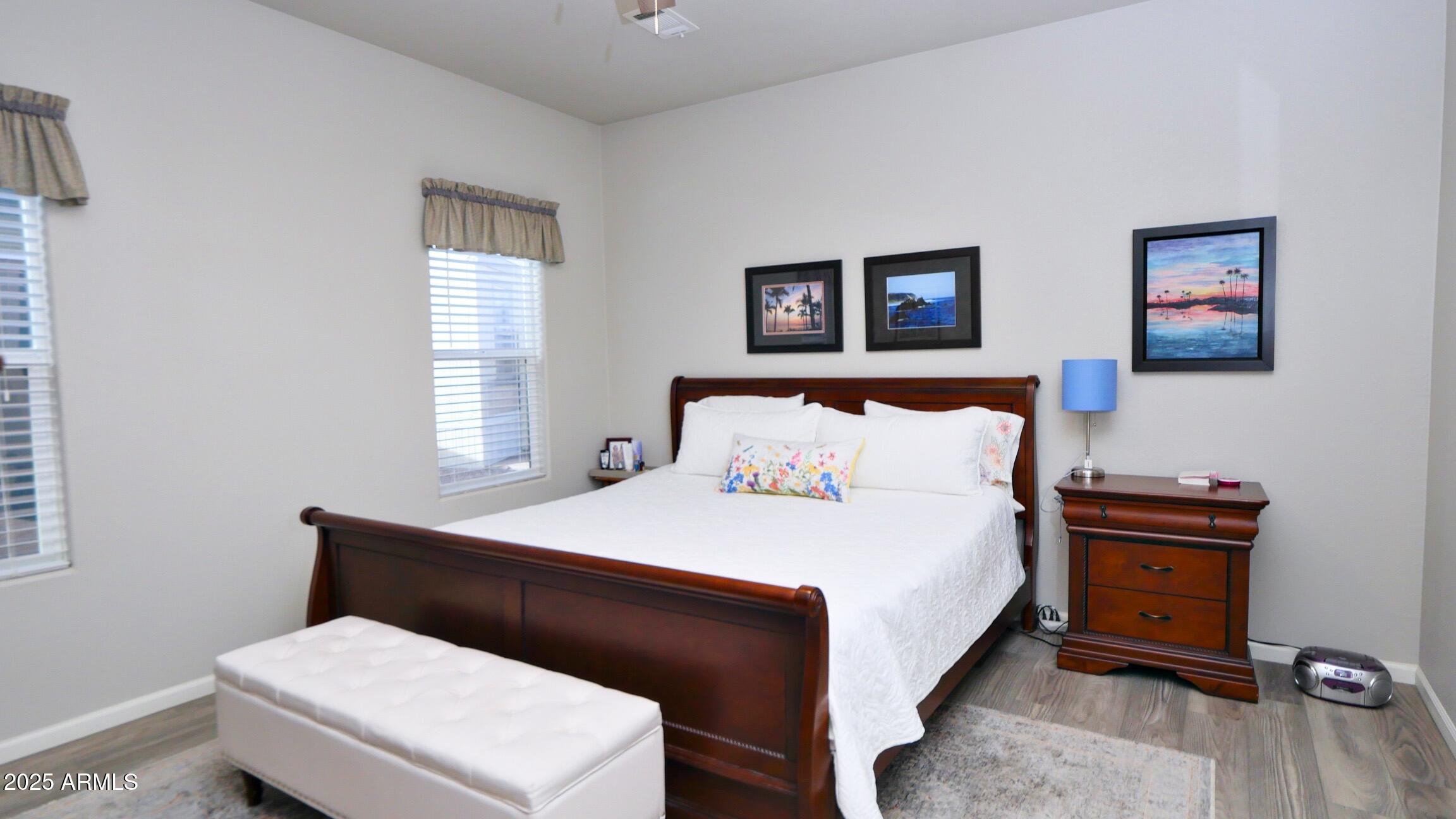 2929 East Main Street, Unit 116 Mesa, AZ 85213 - Photo 17 of 39 a room with a bed and a desk