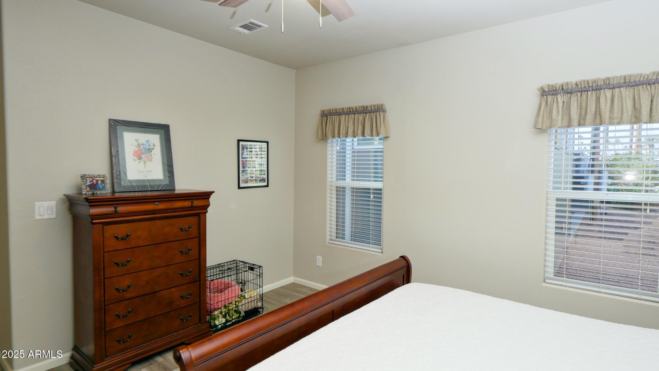 2929 East Main Street, Unit 116 Mesa, AZ 85213 - Photo 19 of 39 a bedroom with a bed and a dresser