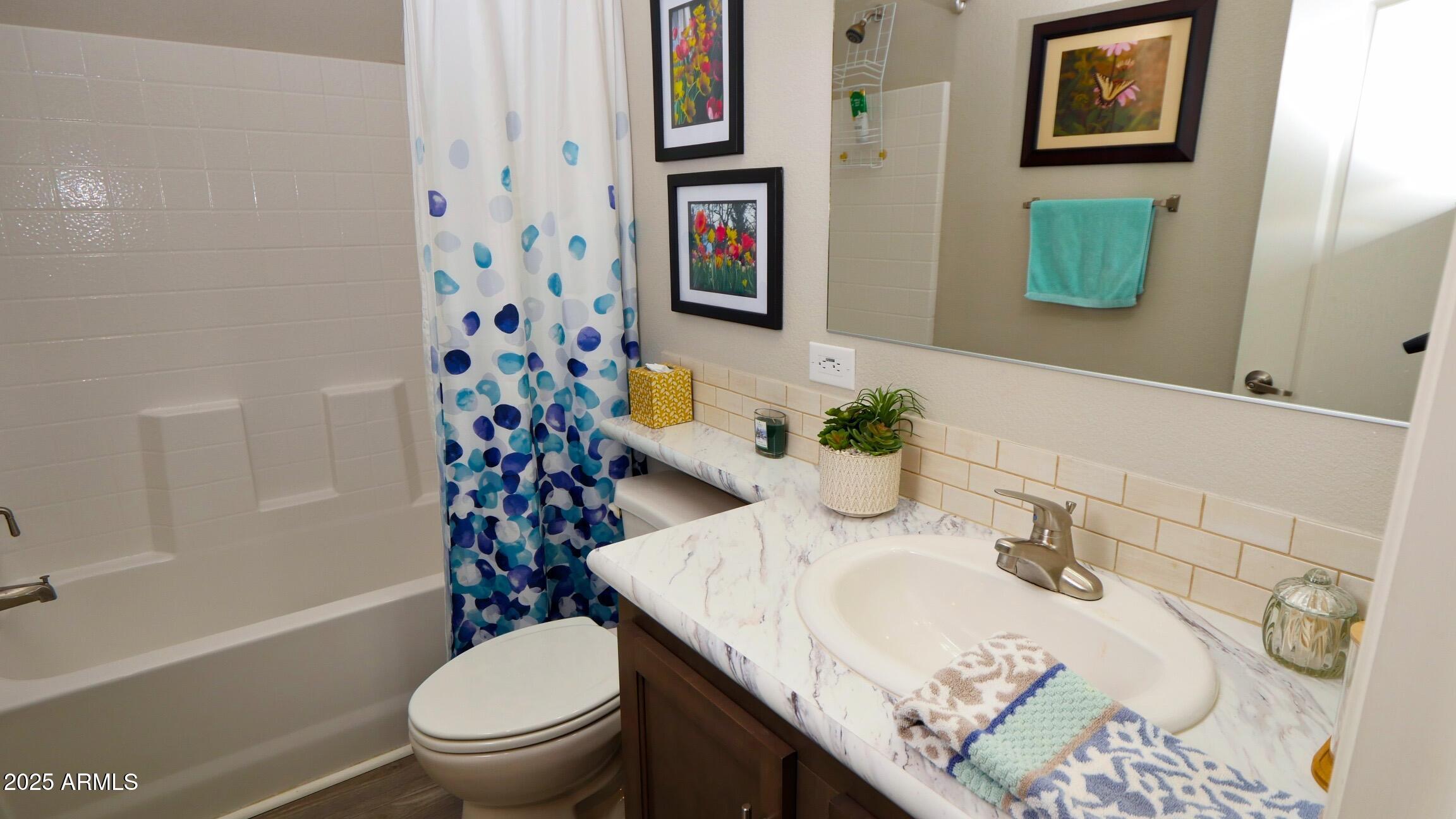 2929 East Main Street, Unit 116 Mesa, AZ 85213 - Photo 21 of 39 a white toilet sitting next to a bathroom sink