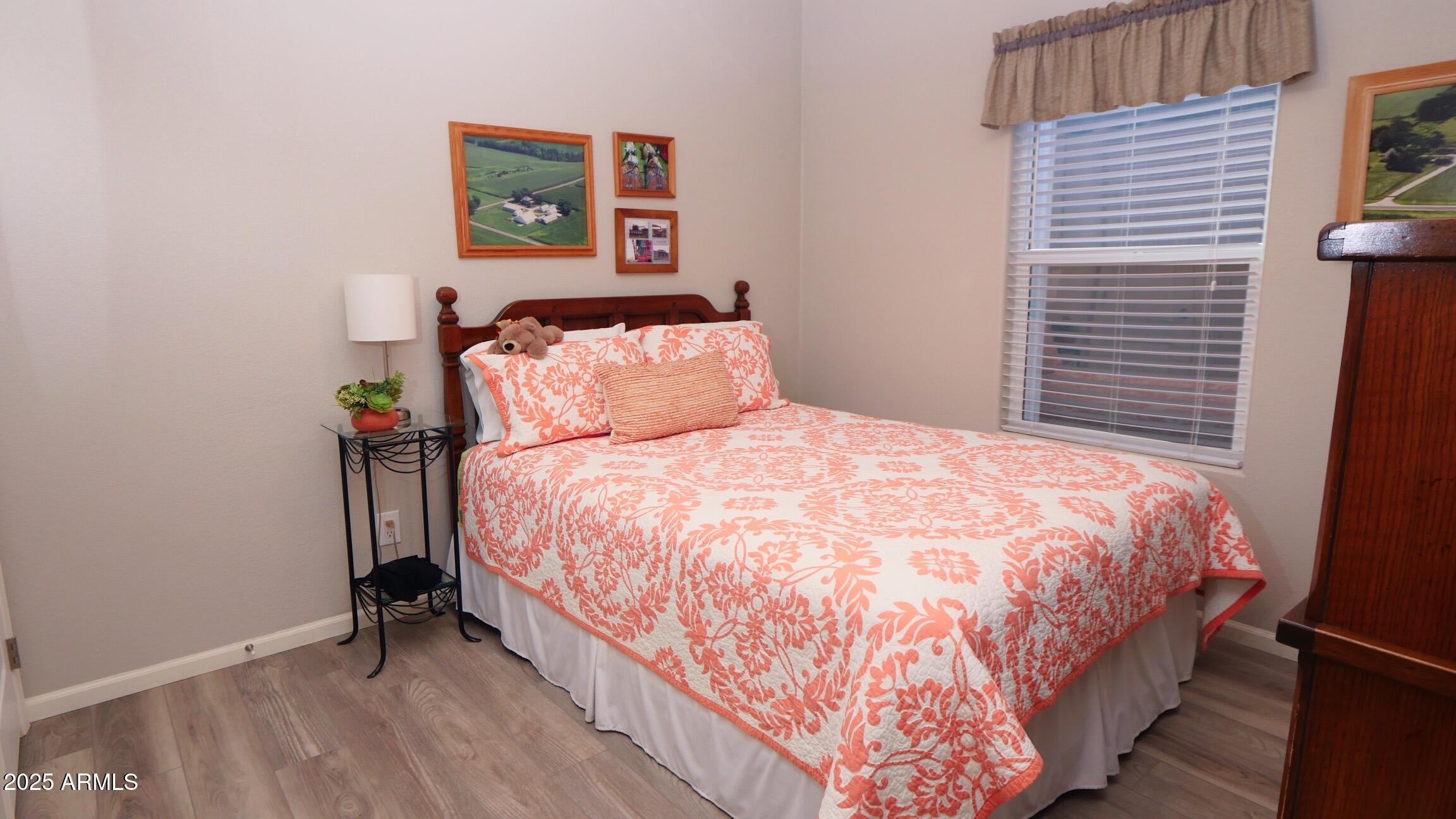 2929 East Main Street, Unit 116 Mesa, AZ 85213 - Photo 23 of 39 a large bed sitting in a bedroom next to a window