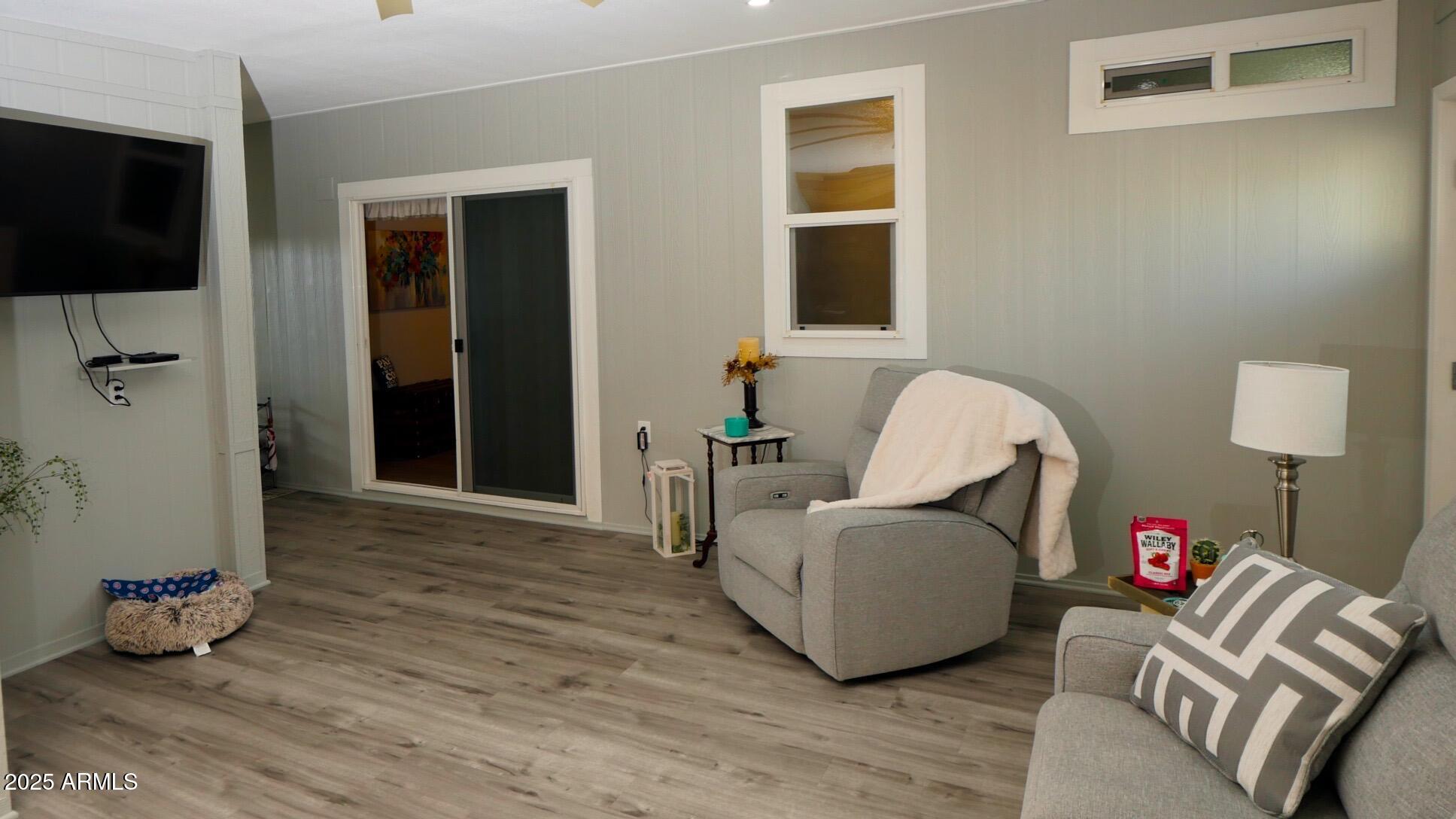 2929 East Main Street, Unit 116 Mesa, AZ 85213 - Photo 31 of 39 a living room with furniture and a flat screen tv