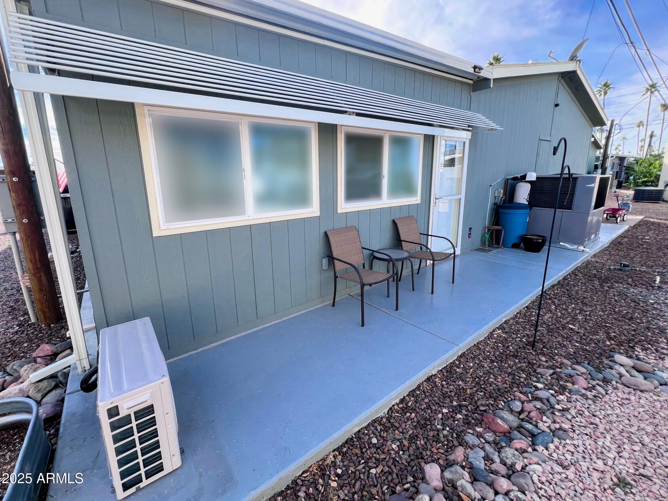2929 East Main Street, Unit 116 Mesa, AZ 85213 - Photo 33 of 39 a view of a patio with table and chairs