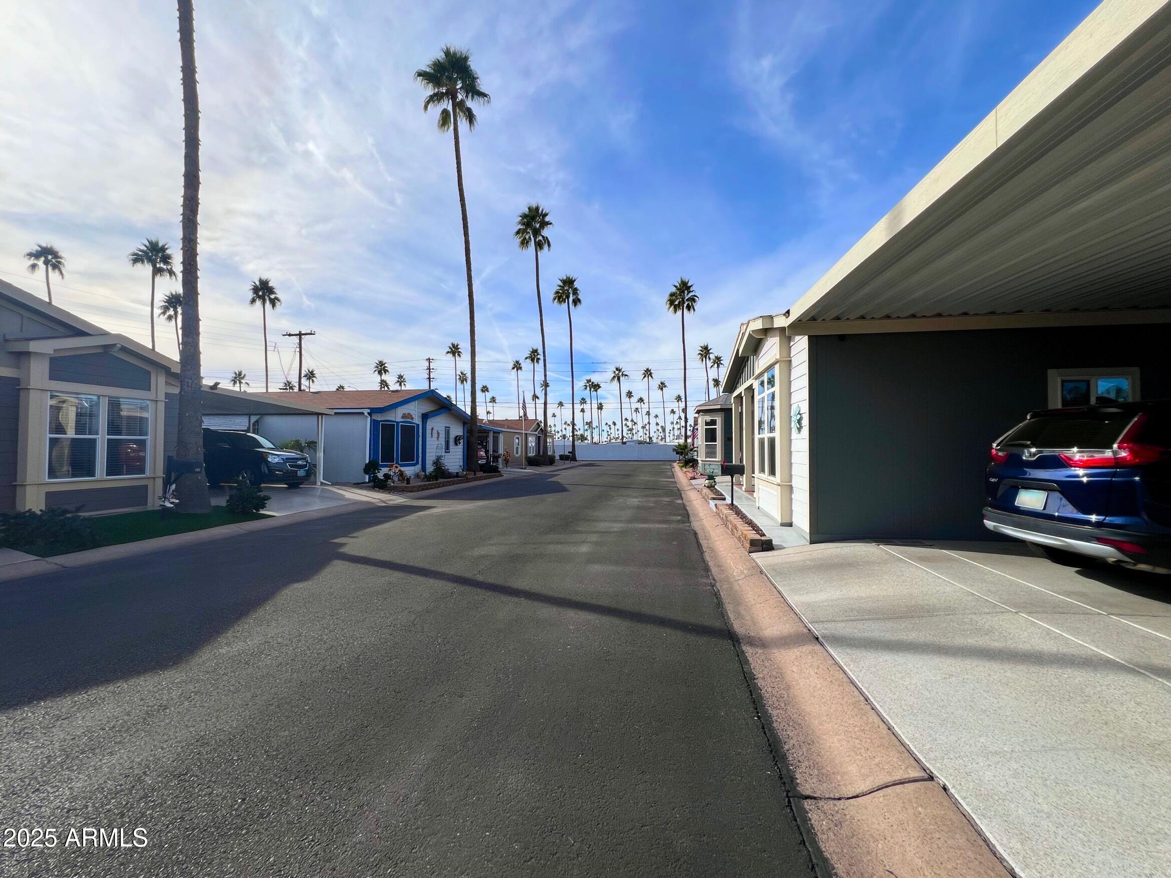 2929 East Main Street, Unit 116 Mesa, AZ 85213 - Photo 36 of 39 a couple of cars parked in front of a building