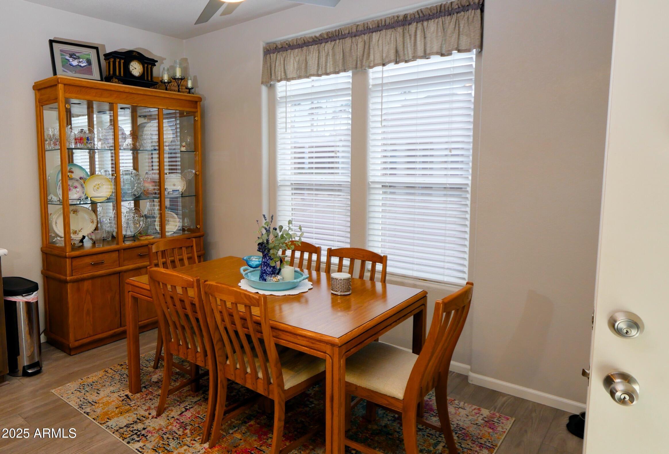 2929 East Main Street, Unit 116 Mesa, AZ 85213 - Photo 8 of 39 a dining room with furniture and window