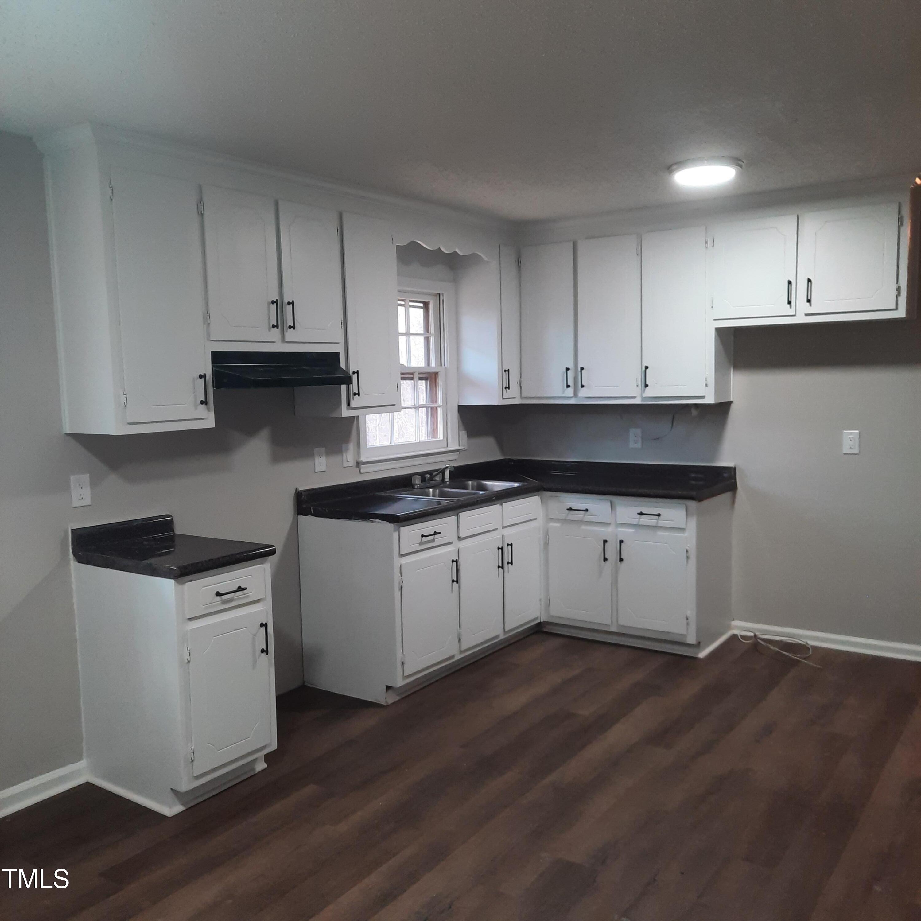 2800 Coleman Loop Road Hillsborough, NC 27278 - Photo 7 of 23 Kitchen has new flooring, fresh paint and refreshed cabinets with new hardware!