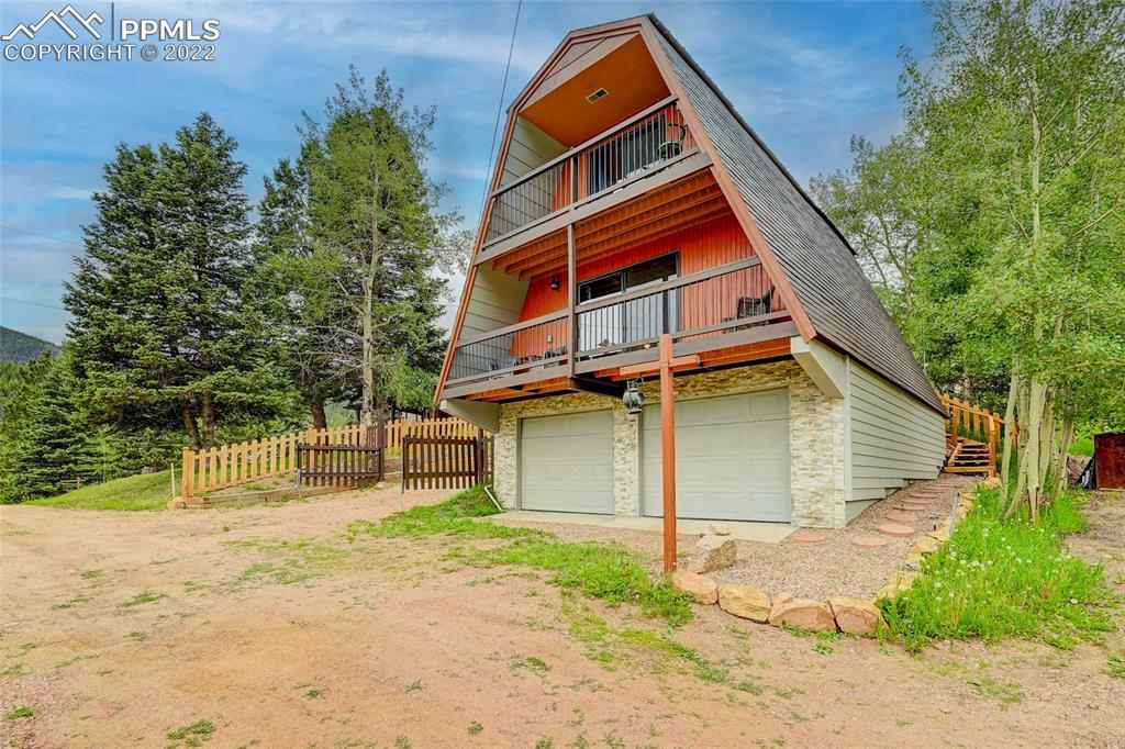 67 Pine Street Rye, CO 81069 - Photo 3 of 42 a backyard of a house with table and chairs