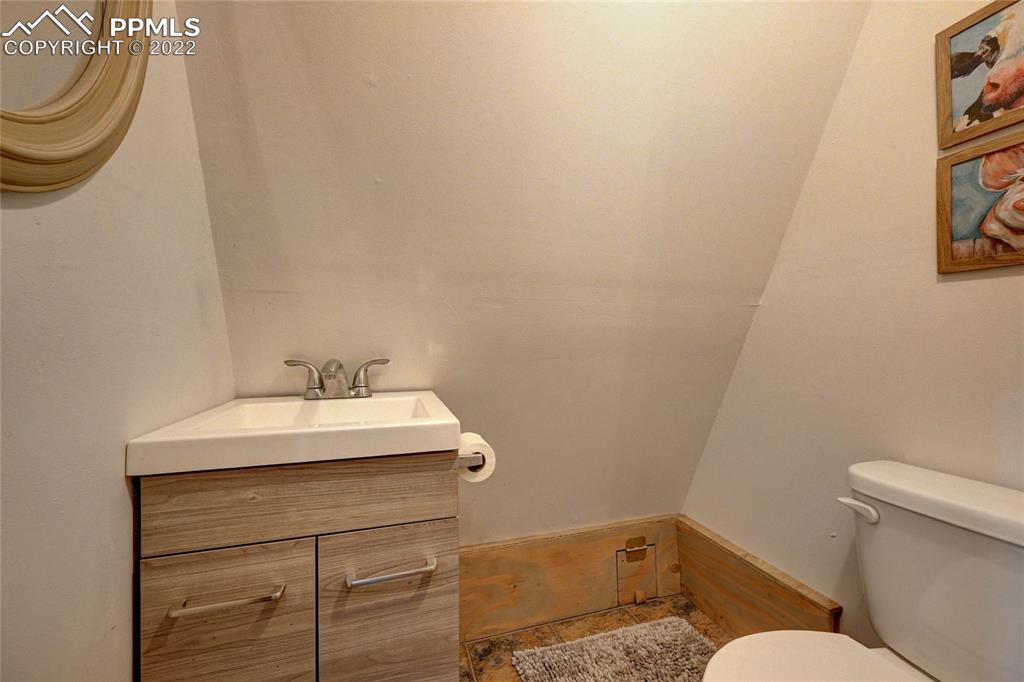 67 Pine Street Rye, CO 81069 - Photo 38 of 42 a bathroom with a sink a toilet and a mirror