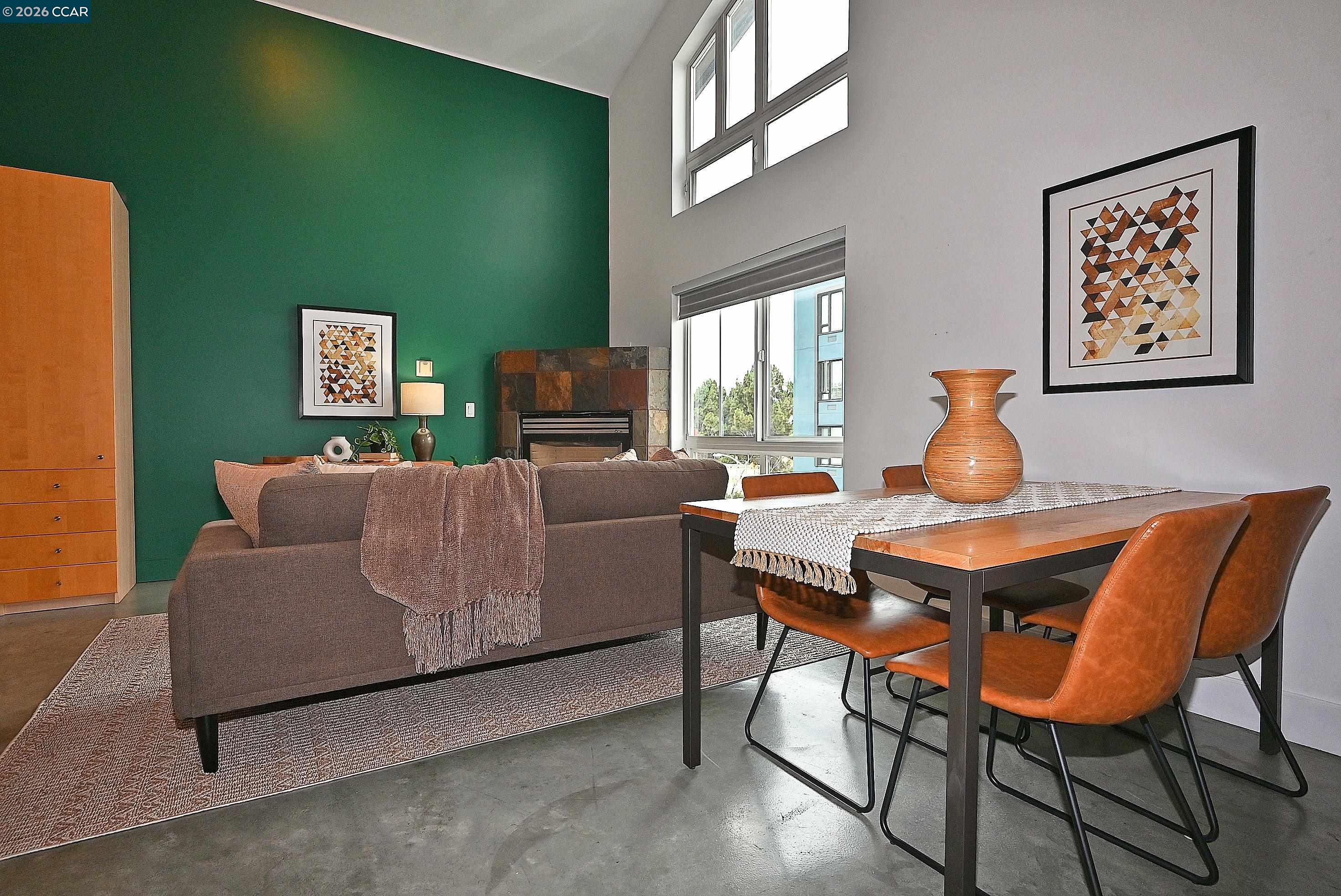 675 8th Street, Unit 15 Oakland, CA 94607 - Photo 14 of 38 a living room with furniture and a window