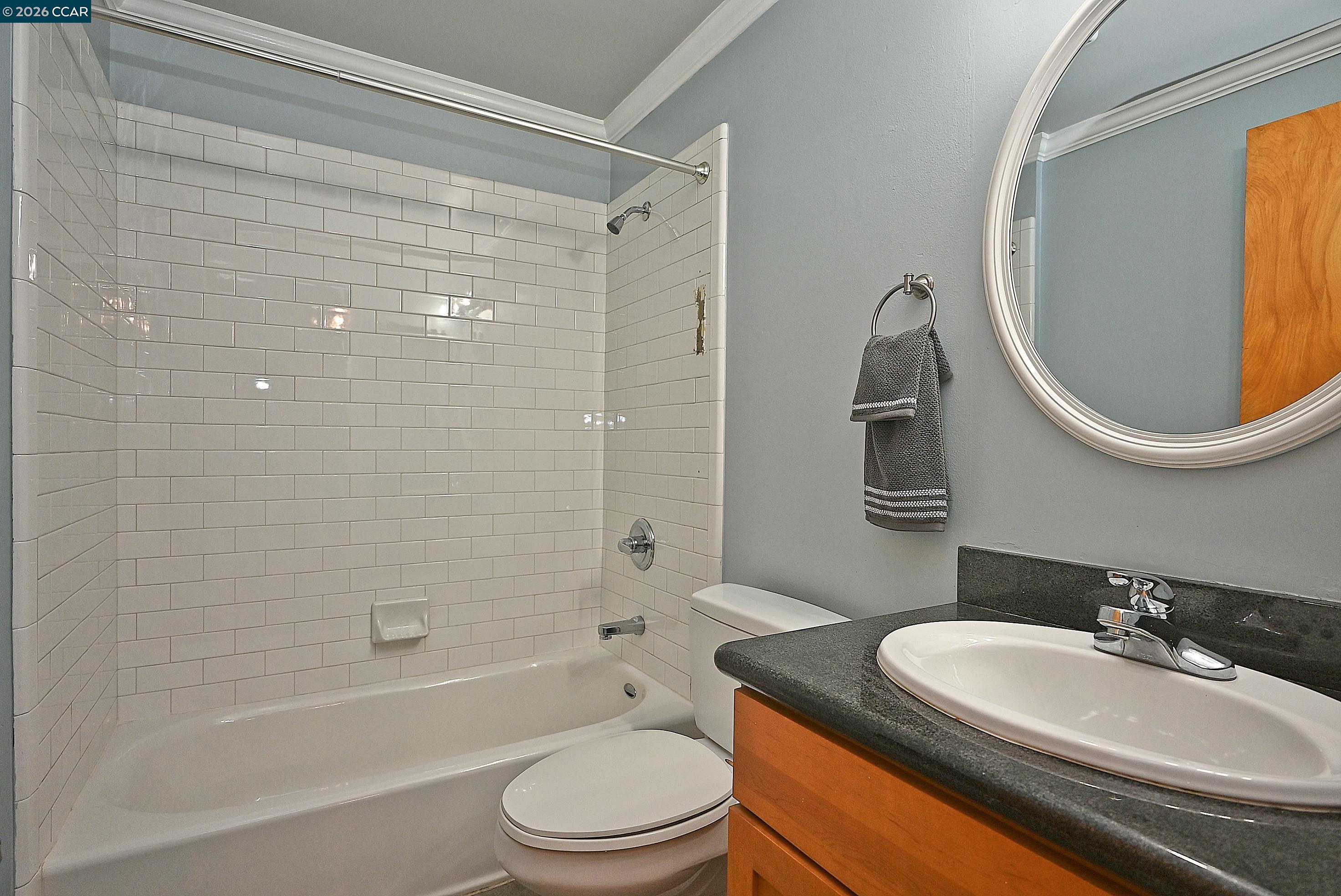 675 8th Street, Unit 15 Oakland, CA 94607 - Photo 21 of 38 a bathroom with a sink a toilet and shower