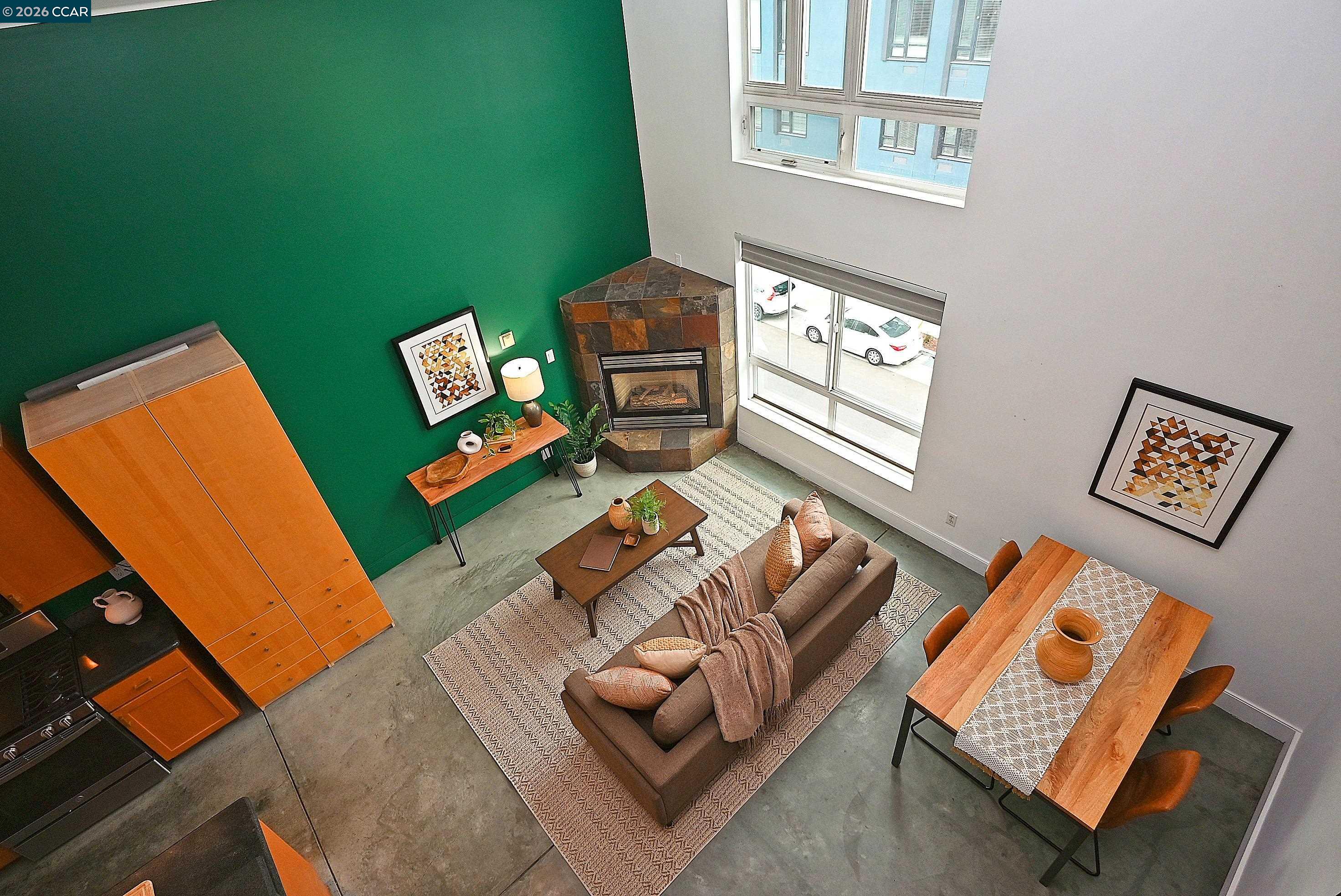 675 8th Street, Unit 15 Oakland, CA 94607 - Photo 5 of 38 view of a living room with furniture and a flat screen tv