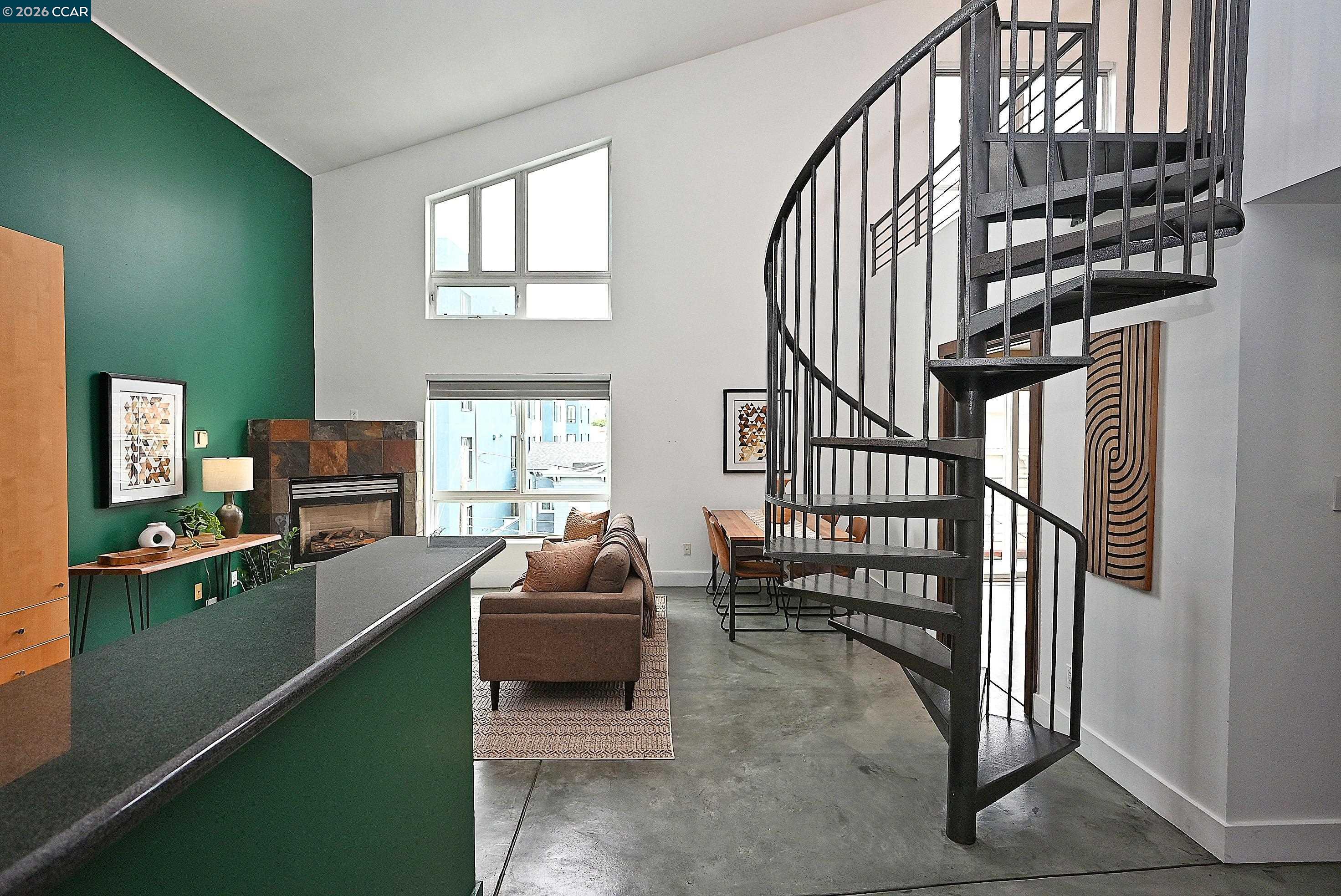 675 8th Street, Unit 15 Oakland, CA 94607 - Photo 6 of 38 a living room with furniture