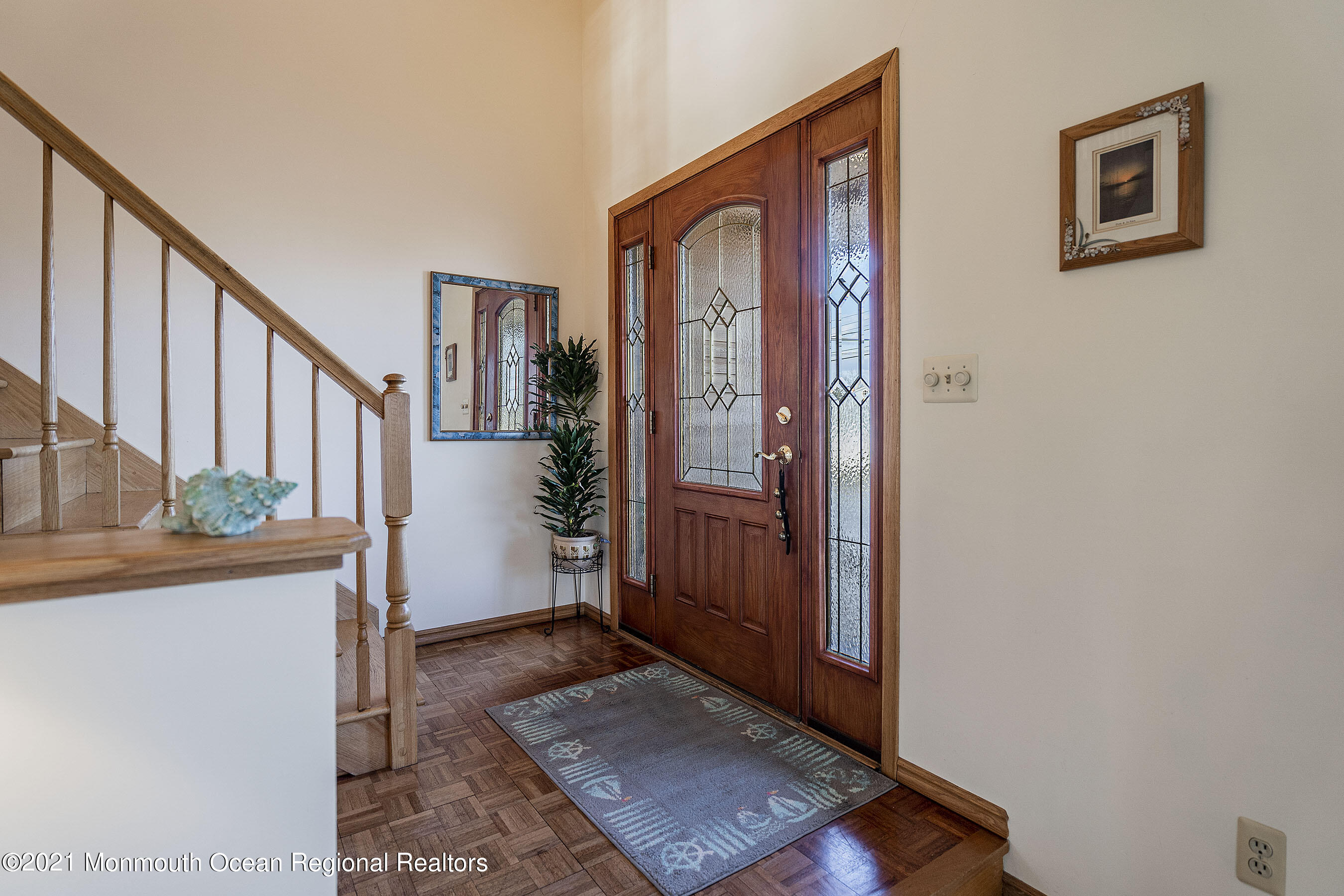 9 Sands Point Road Waretown, NJ 08758 - Photo 8 of 70 a view of an entryway with wooden floor and stairs