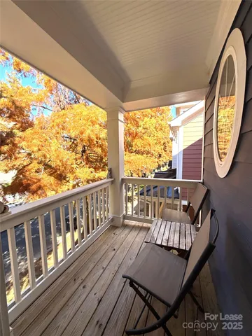 a view of a chairs and table on the balcony