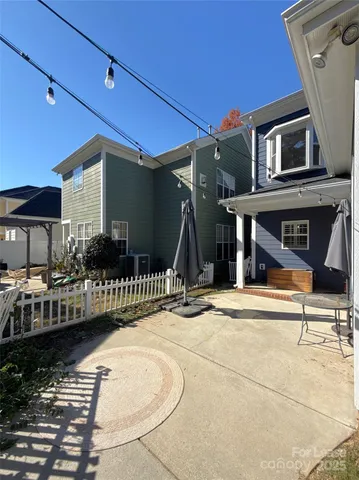 a view of a house with wooden deck