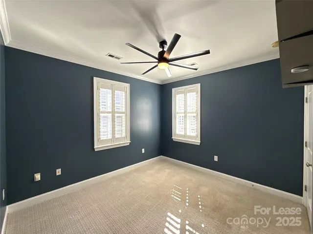 a workspace with windows and ceiling fan