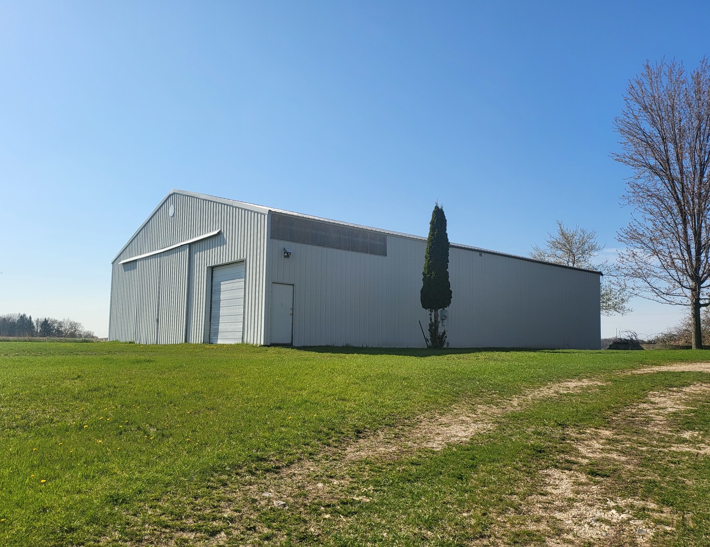 W8479 Townline Road Whitewater, WI 53190 - Photo 2 of 8 a big house with a yard