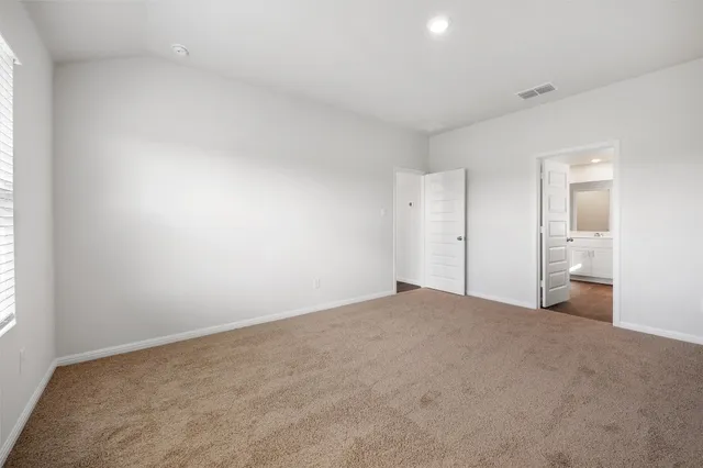 a bathroom with a double vanity sink and mirror