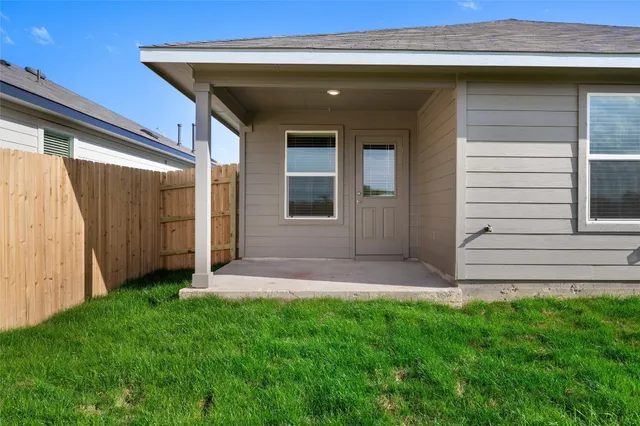 an aerial view of a house with a ocean view