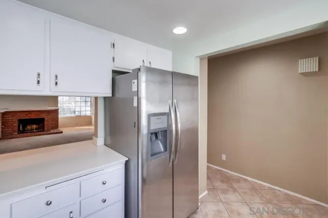 a kitchen with cabinets and stainless steel appliances