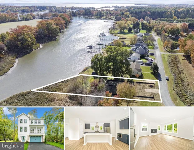 an aerial view of residential houses with outdoor space and river