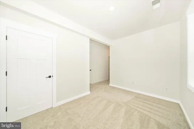 a view of a living room with kitchen island furniture and wooden floor